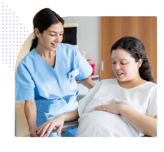 Nurse helping pregnant women out of chair